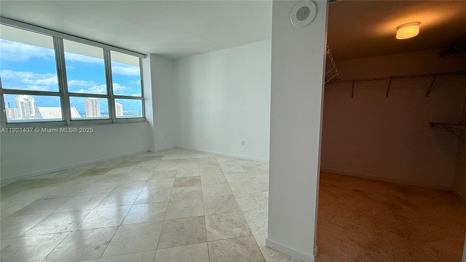 1155 Brickell Bay Drive, Unit PH104 Miami, FL 33131 - Photo 16 of 35 a view of an empty room with a window