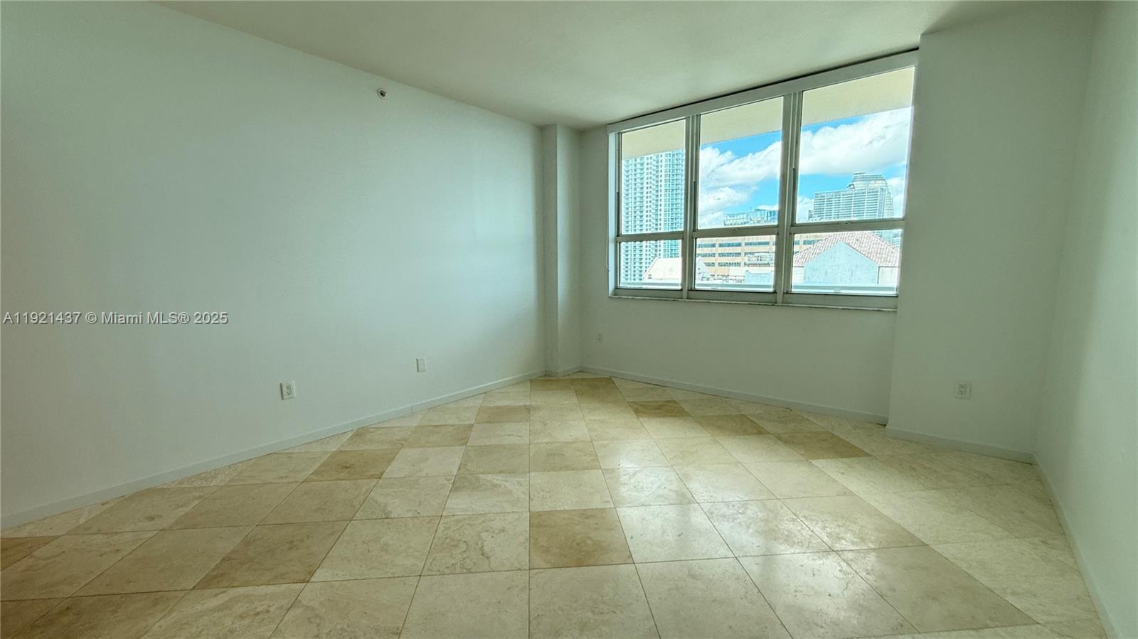 1155 Brickell Bay Drive, Unit PH104 Miami, FL 33131 - Photo 17 of 35 a view of an empty room with a window