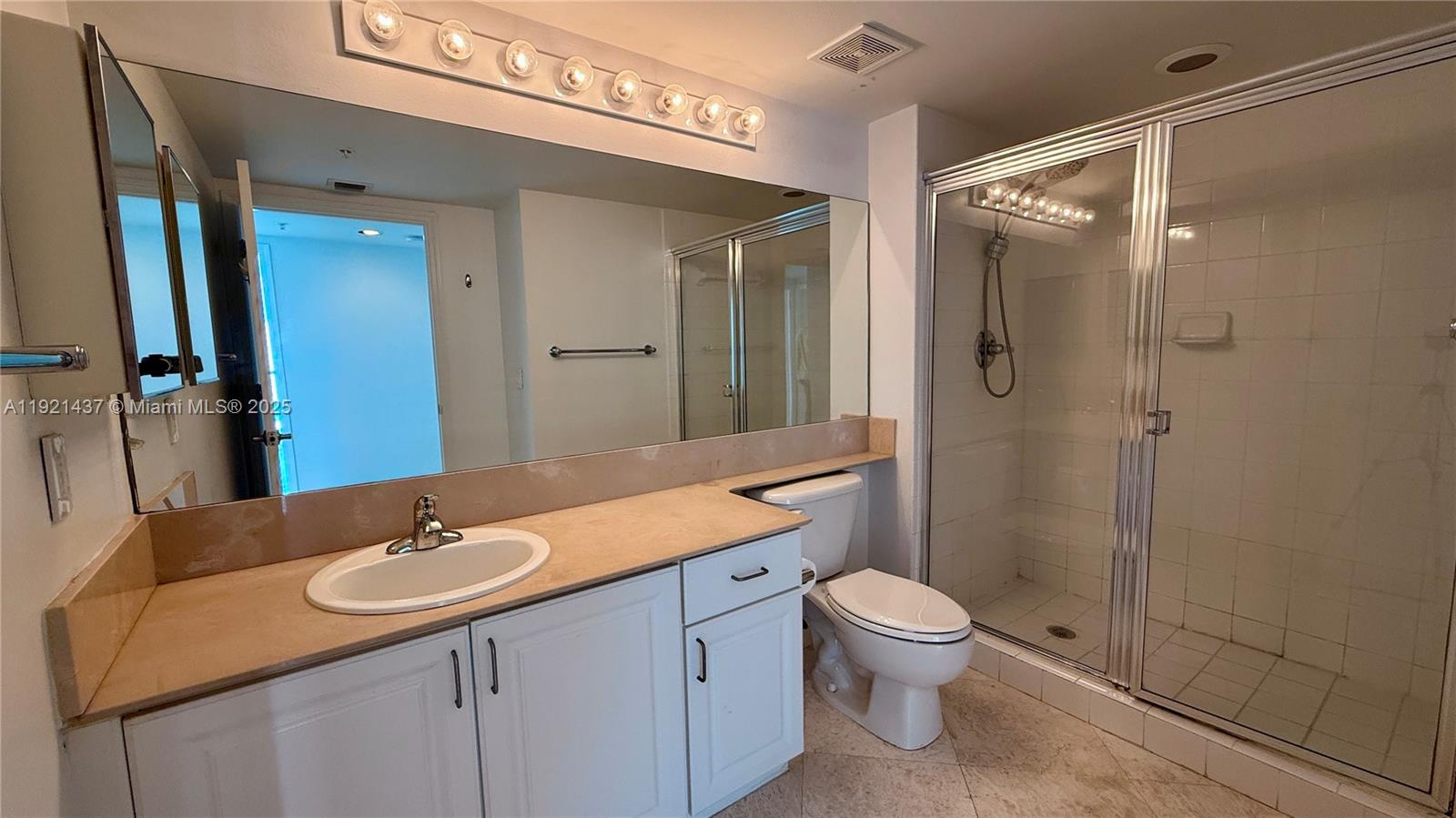 1155 Brickell Bay Drive, Unit PH104 Miami, FL 33131 - Photo 18 of 35 a bathroom with a sink toilet and shower