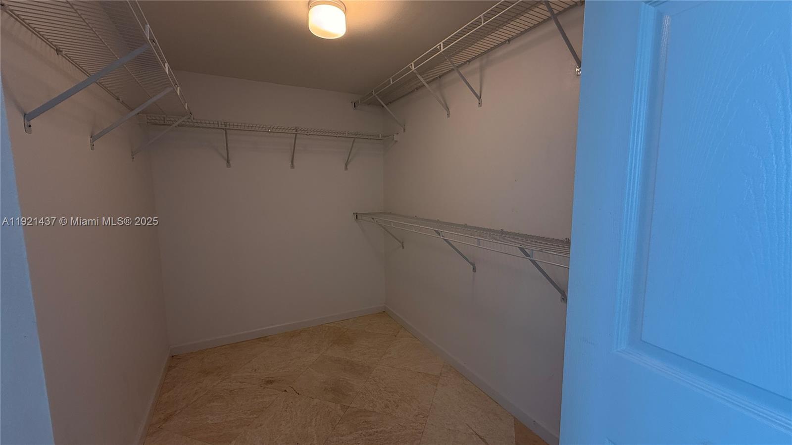 1155 Brickell Bay Drive, Unit PH104 Miami, FL 33131 - Photo 20 of 35 a view of a room with racks on the wall