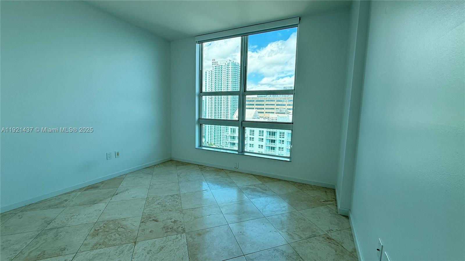 1155 Brickell Bay Drive, Unit PH104 Miami, FL 33131 - Photo 23 of 35 a view of an empty room and window