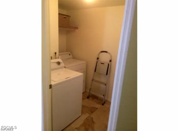a bathroom with a sink and mirror with toilet
