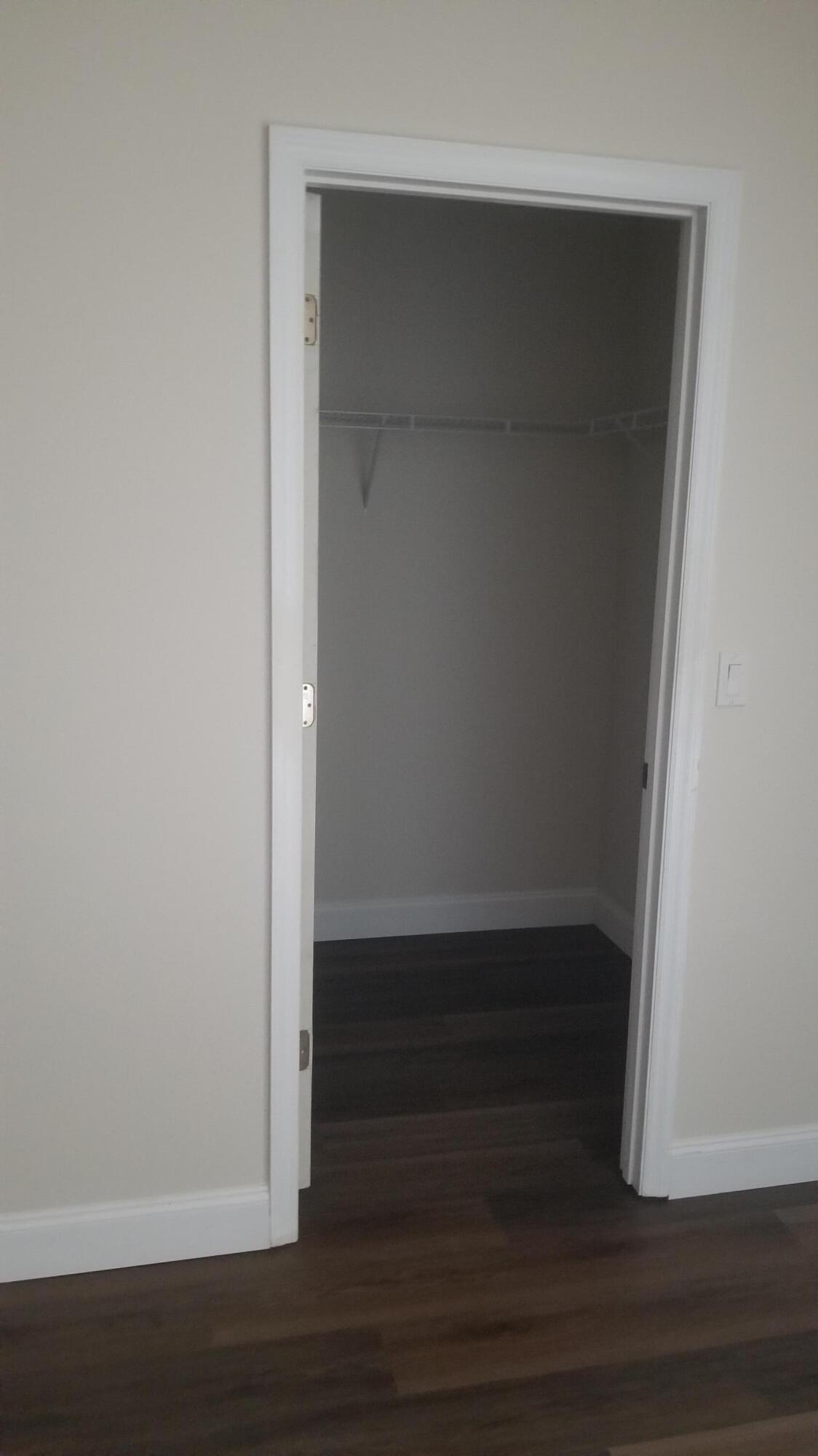 85 Pinafore Place Indialantic, FL 32903 - Photo 12 of 13 a view of walk in closet with empty racks