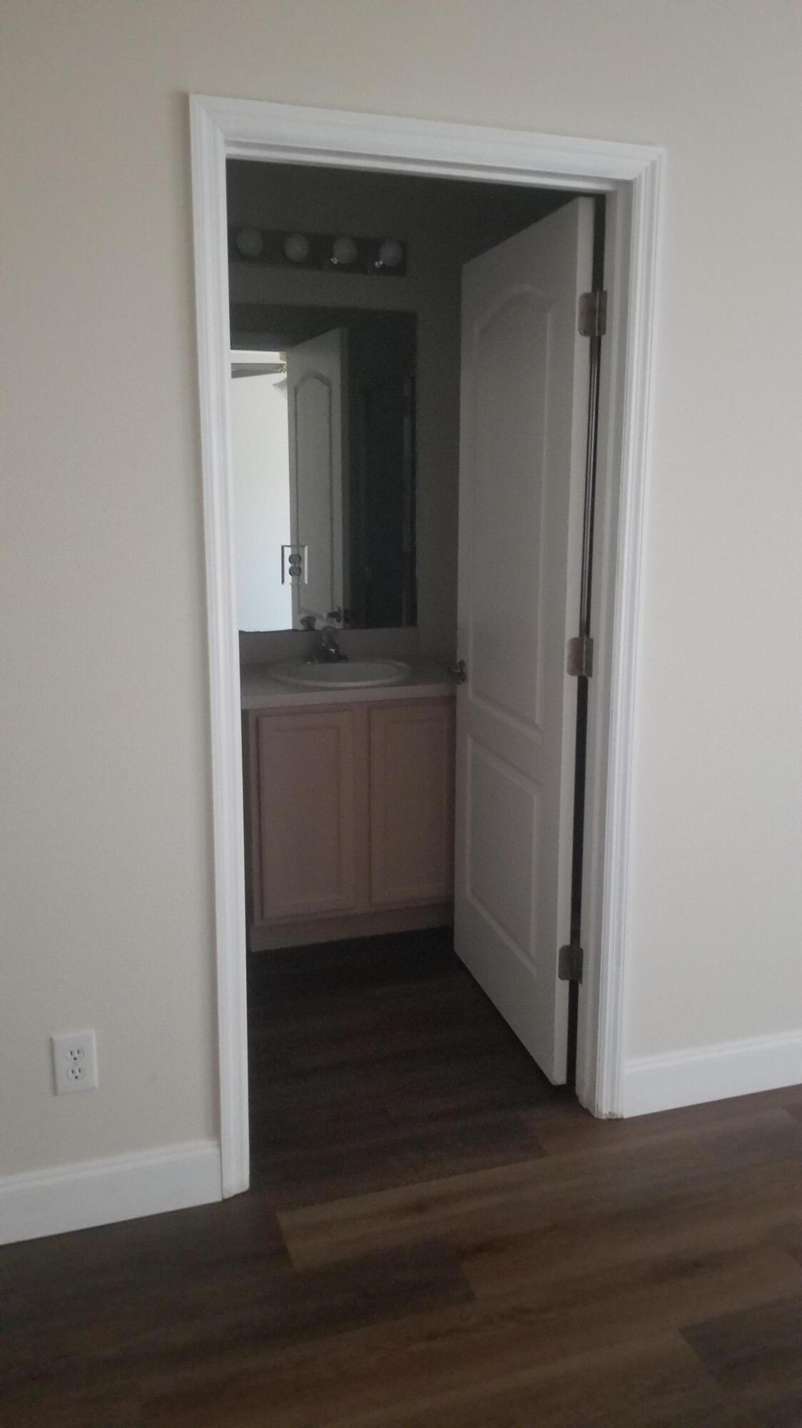 85 Pinafore Place Indialantic, FL 32903 - Photo 13 of 13 a room with wooden floor and cabinet