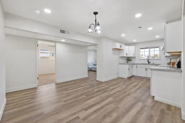 a view of kitchen with wooden floor
