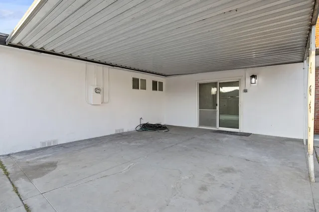 a view of a livingroom with an empty space and a window