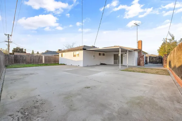 a house view with a big yard