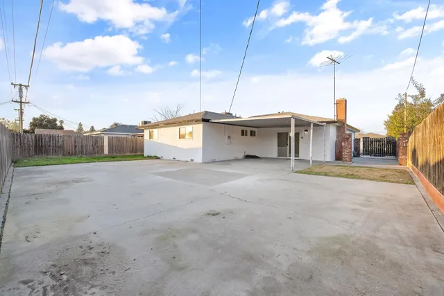 a house view with a big yard