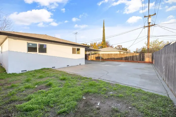 a view of a backyard of the house