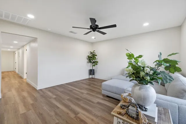a view of a livingroom with furniture and a potted plant