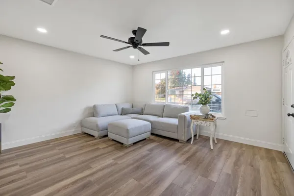 a living room with furniture and a large window