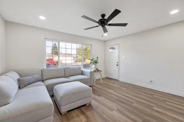 a living room with furniture and windows