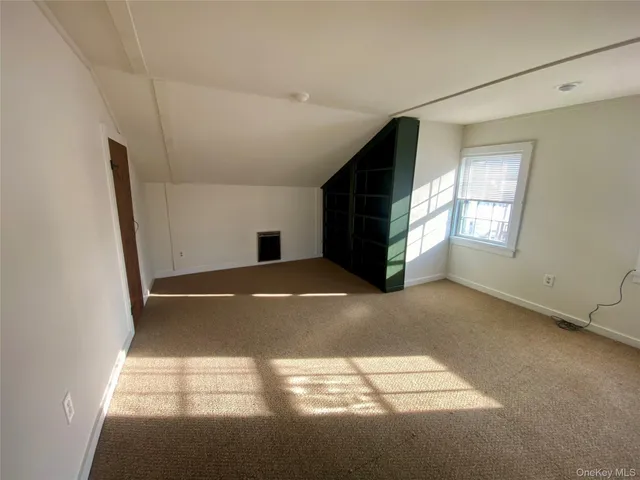 a view of empty room with windows