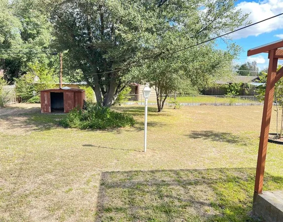 a view of a yard with an outdoor space