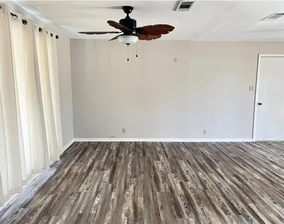 a view of a livingroom with a hardwood floor