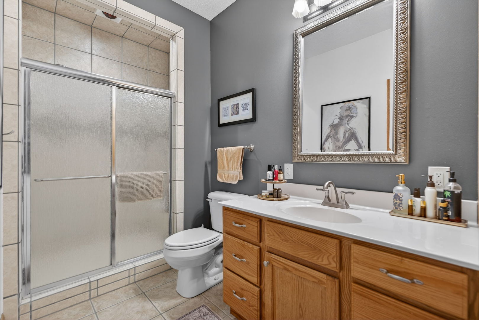 124 5th Street Fulton, IL 61252 - Photo 14 of 45 a bathroom with a toilet sink and shower