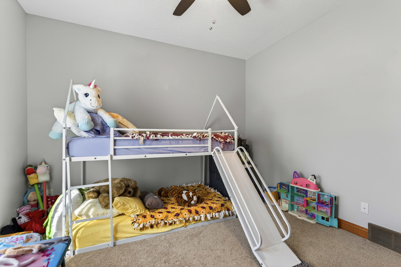 124 5th Street Fulton, IL 61252 - Photo 16 of 45 a bedroom with bed and a chandelier