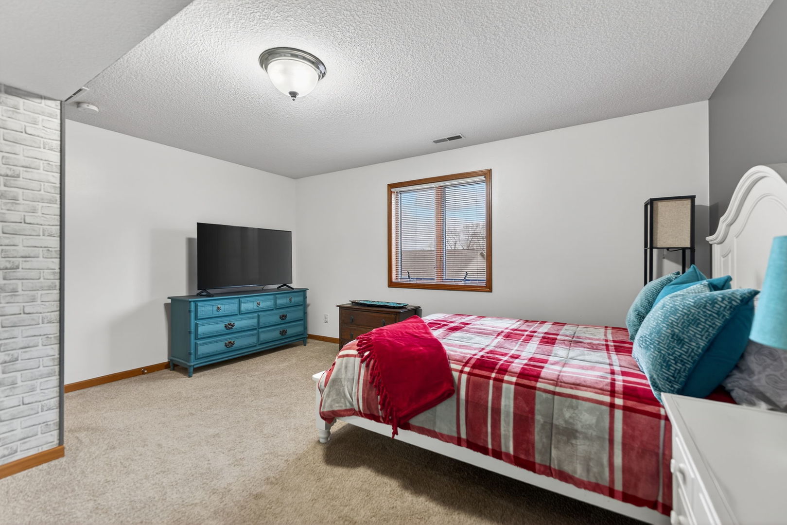 124 5th Street Fulton, IL 61252 - Photo 27 of 45 a bedroom with a bed and a tv