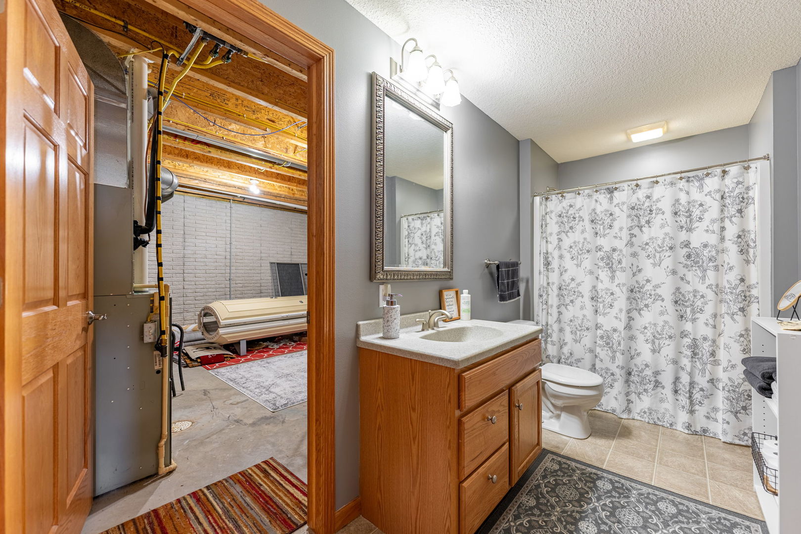 124 5th Street Fulton, IL 61252 - Photo 28 of 45 a bathroom with a sink toilet and shower