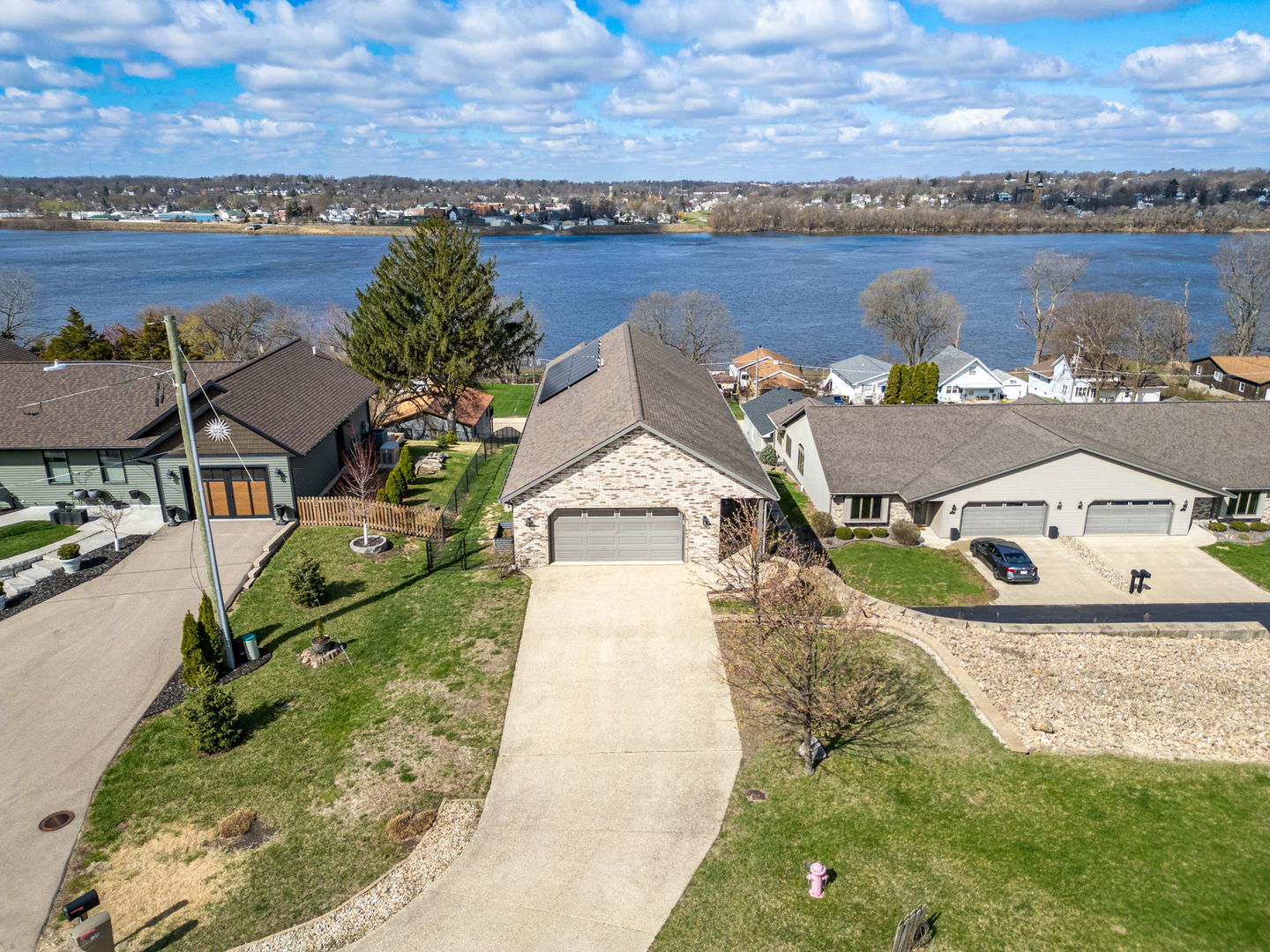124 5th Street Fulton, IL 61252 - Photo 32 of 45 an aerial view of a house with outdoor space and lake view in back