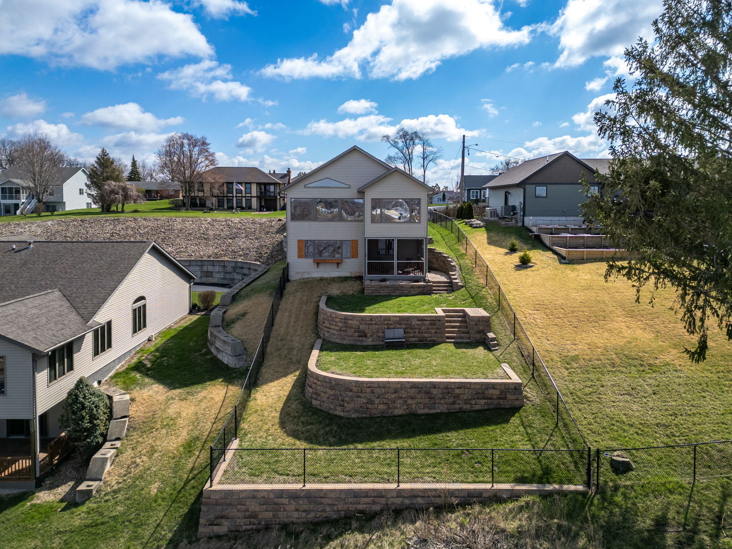 124 5th Street Fulton, IL 61252 - Photo 36 of 45 a view of a house with a yard and potted plants