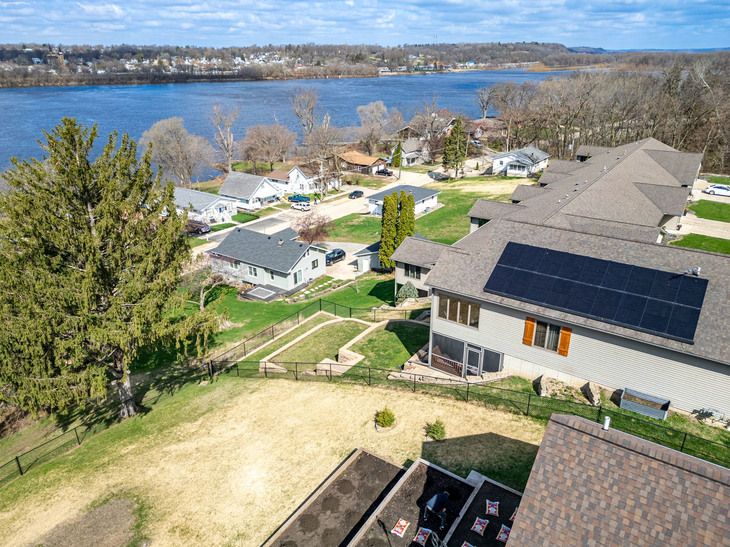 124 5th Street Fulton, IL 61252 - Photo 38 of 45 a view of a lake with couches in front of house
