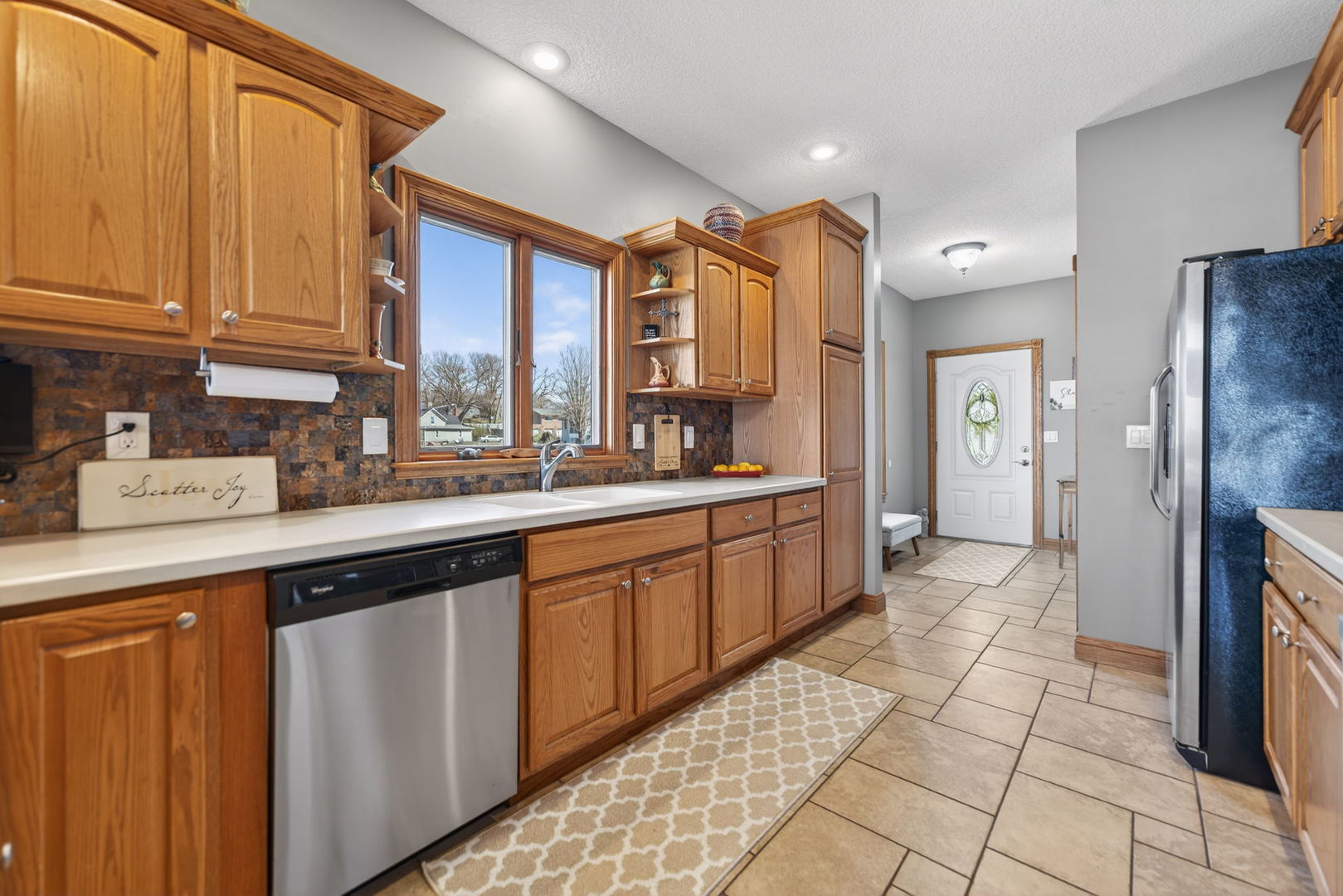 124 5th Street Fulton, IL 61252 - Photo 10 of 45 a kitchen with stainless steel appliances granite countertop a refrigerator and a sink
