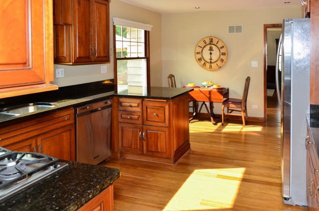541 Post Road St. Charles, IL 60174 - Photo 3 of 13 a kitchen with stainless steel appliances granite countertop a refrigerator and a stove