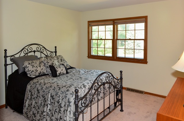 541 Post Road St. Charles, IL 60174 - Photo 8 of 13 a bedroom with a bed and a window