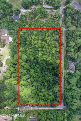 a street sign that is sitting in the grass