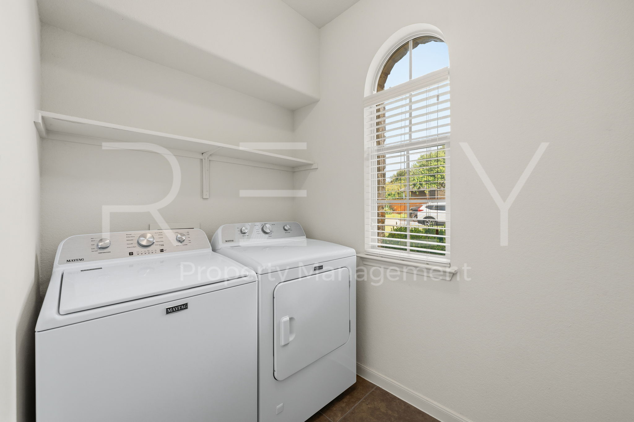 1405 Sunny Meadows Loop Georgetown, TX 78626 - Photo 13 of 40 A well-appointed laundry area offers convenient household utility with ample natural light.