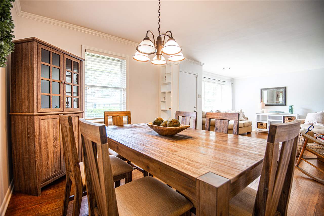 1512 Whitewater Road Memphis, TN 38117 - Photo 7 of 25 a dining room with wooden floor and large windows