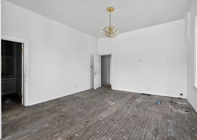 a view of entryway with wooden floor and staircase