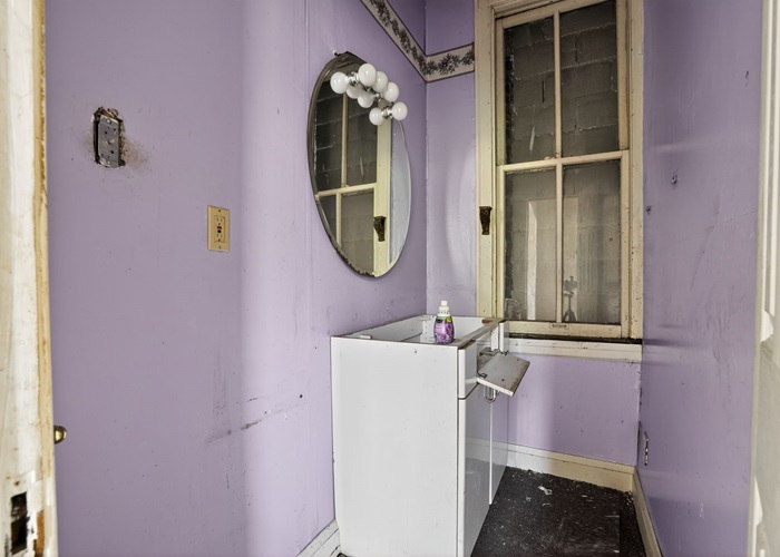 1114 West 51st Street Chicago, IL 60609 - Photo 19 of 20 a bathroom with a sink and a mirror