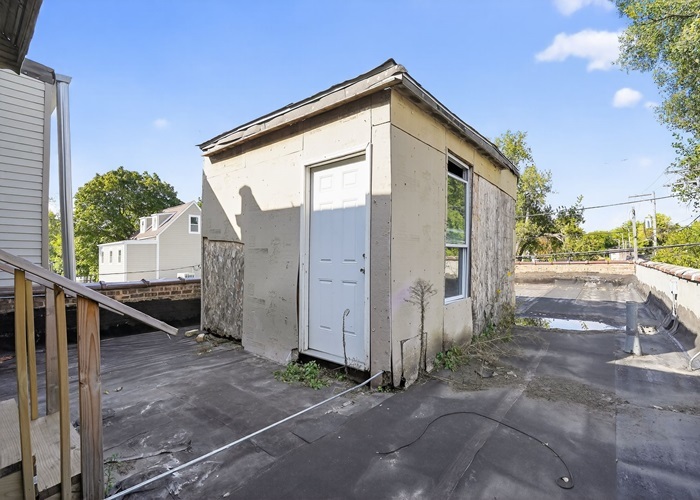 1114 West 51st Street Chicago, IL 60609 - Photo 4 of 20 a front view of a house with a yard