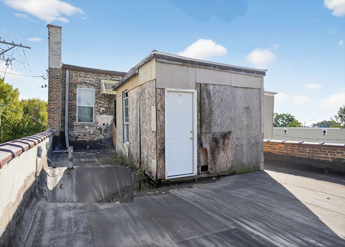 1114 West 51st Street Chicago, IL 60609 - Photo 6 of 20 a view of a house with backyard and sitting area