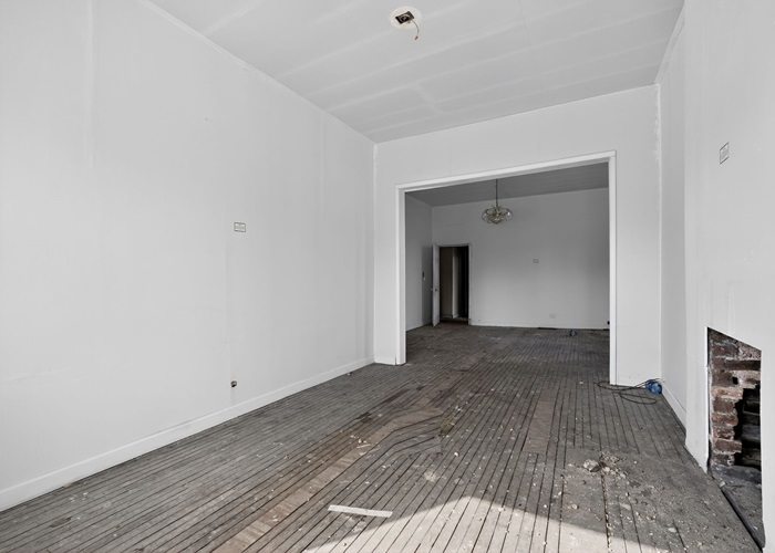 1114 West 51st Street Chicago, IL 60609 - Photo 8 of 20 a view of a hallway with wooden floor and a bathroom