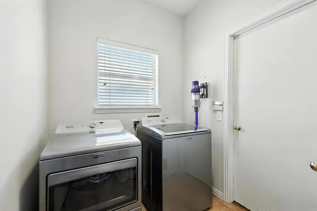 a utility room with dryer and washer