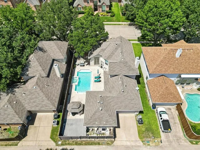 an aerial view of a house with outdoor space