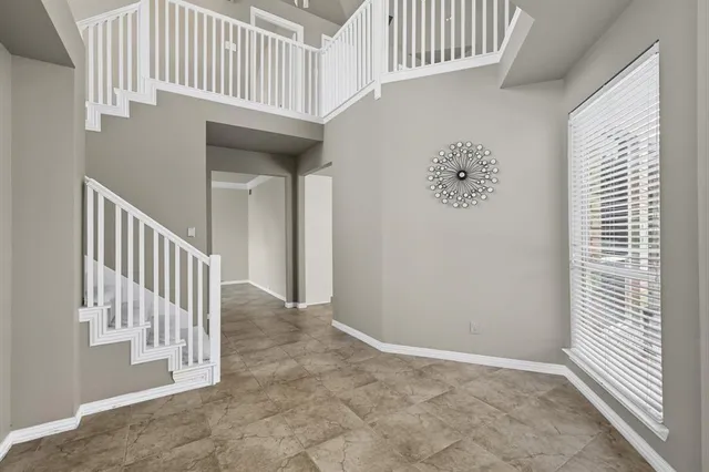 a view of a hallway with entryway