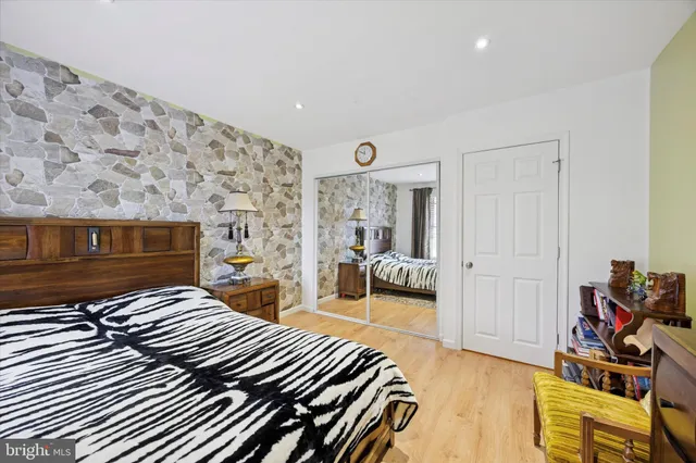 a bedroom with a bed and a couch