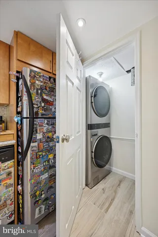 a view of a hallway with washer and dryer