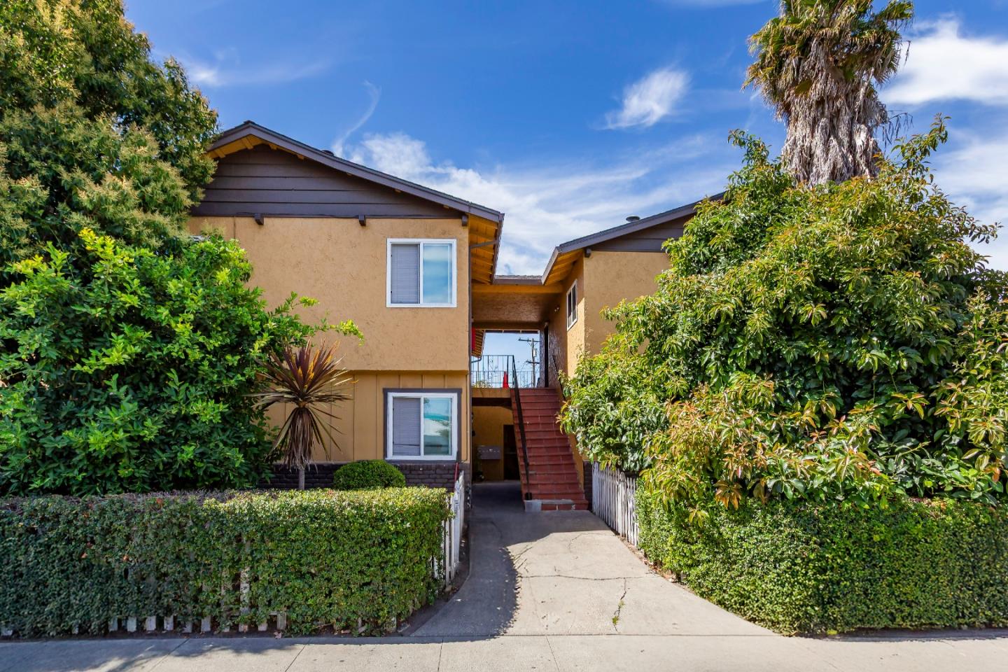 2136 Main Street Santa Clara, CA 95050 - Photo 2 of 10 a front view of a house with a yard and trees