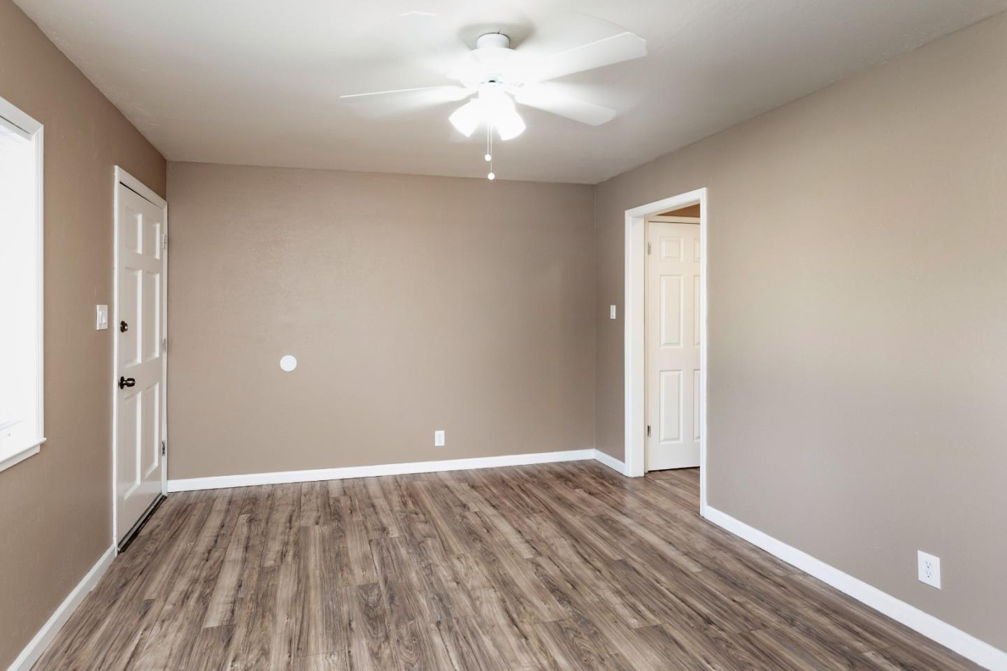 2136 Main Street Santa Clara, CA 95050 - Photo 3 of 10 wooden floor in an empty room with a window