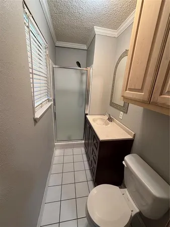 a bathroom with a sink a toilet a mirror and shower