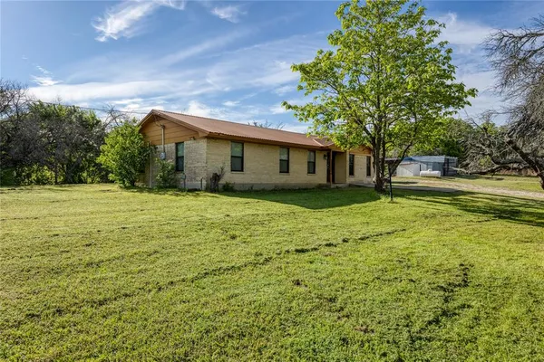 a view of a house with a big yard