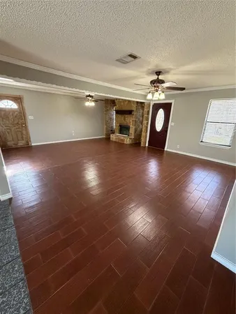 a view of a livingroom with furniture and a window