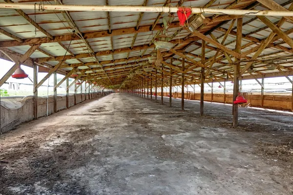 a view of a patio with table and chairs with wooden floor and fence