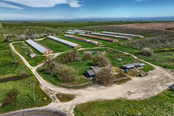an aerial view of a house with a garden