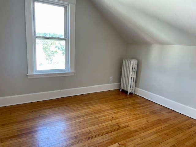 44 Boardman Street Worcester, MA 01606 - Photo 8 of 29 a view of an empty room with wooden floor and a window